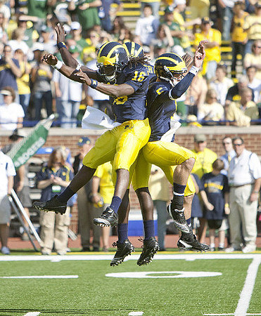 Denard Robinson (16), Tate Forcier (5), and Vincent Smith (2)