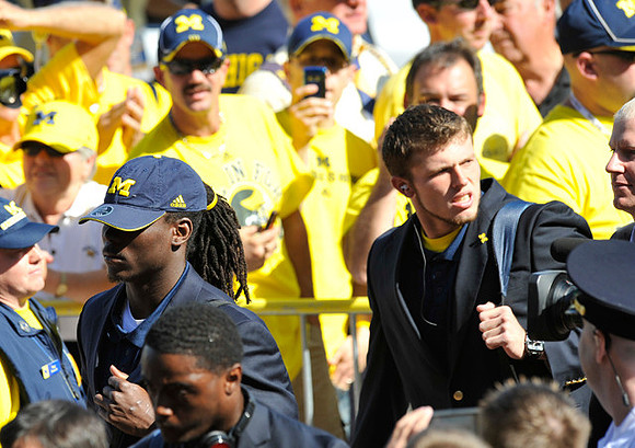 Denard Robinson (16) and Tate Forcier (5)