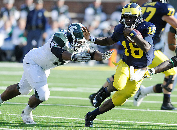 Denard Robinson (16) and Taylor Lewan (77)