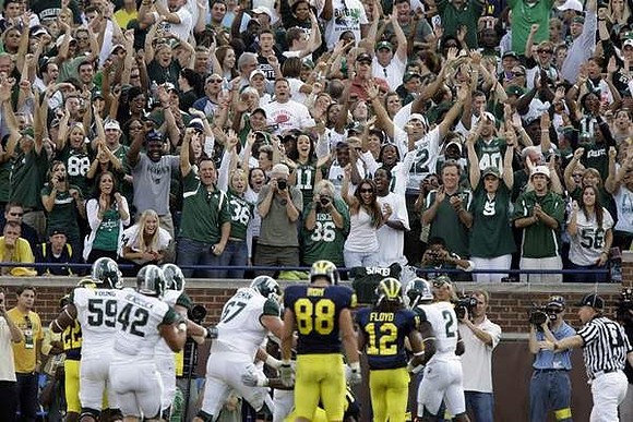 Terrence Talbott (22), Craig Roh (88), and J.T. Floyd (12)