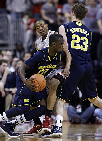 Tim Hardaway Jr. (10) and Evan Smotrycz (23)