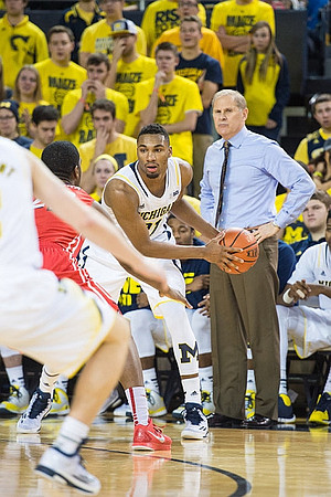 Zak Irvin (21) and John Beilein
