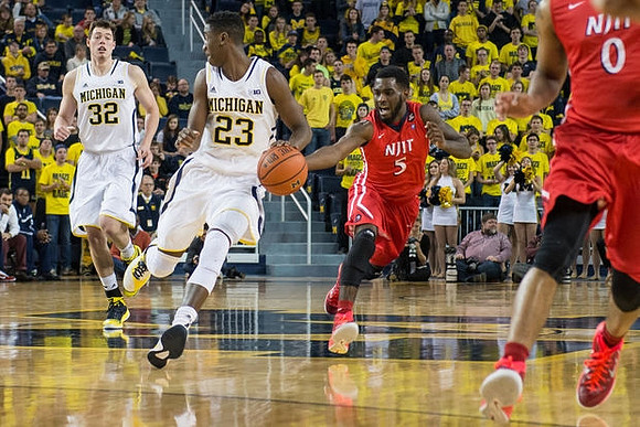Ricky Doyle (32) and Caris LeVert (23)