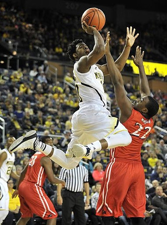 Derrick Walton Jr. (10) and Zak Irvin (21)