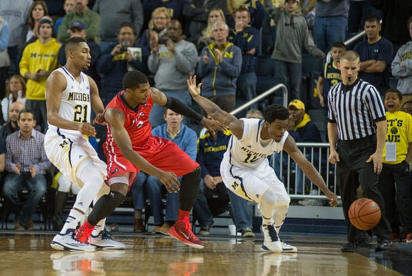 Zak Irvin (21) and Derrick Walton Jr. (10)