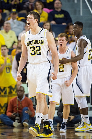 Ricky Doyle (32), Spike Albrecht (2), and Caris LeVert (23)