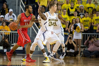 Caris LeVert (23), Mark Donnal (34), and Zak Irvin (21)