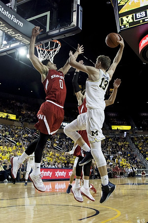 Moritz Wagner (13) and Derrick Walton Jr. (10)