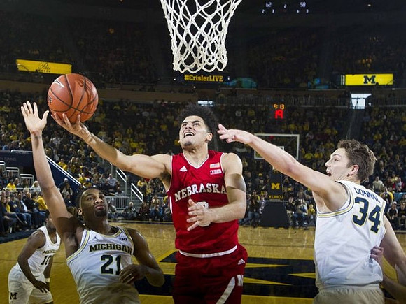 Derrick Walton Jr. (10), Zak Irvin (21), and Mark Donnal (34)