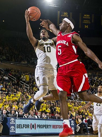 Derrick Walton Jr. (10) and Zak Irvin (21)