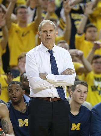 Xavier Simpson (3), John Beilein, and Andrew Dakich (11)