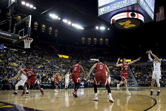 D.J. Wilson (5), Moritz Wagner (13), and Duncan Robinson (22)