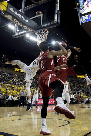 Moritz Wagner (13), D.J. Wilson (5), and Derrick Walton Jr. (10)