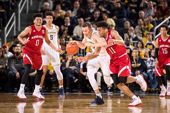 D.J. Wilson (5) and Duncan Robinson (22)