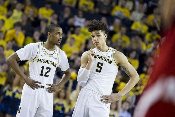 Muhammad-Ali Abdur-Rahkman (12) and D.J. Wilson (5)