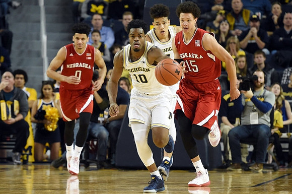 Derrick Walton Jr. (10) and D.J. Wilson (5)