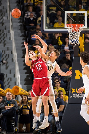 Moritz Wagner (13) and D.J. Wilson (5)