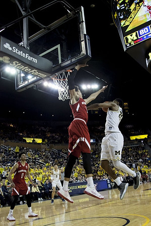 Zak Irvin (21) and D.J. Wilson (5)