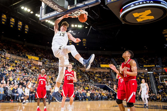 Moritz Wagner (13), Xavier Simpson (3), and Duncan Robinson (22)