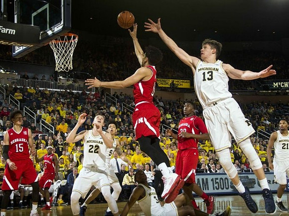 Duncan Robinson (22), D.J. Wilson (5), Xavier Simpson (3), Moritz Wagner (13), and Zak Irvin (21)