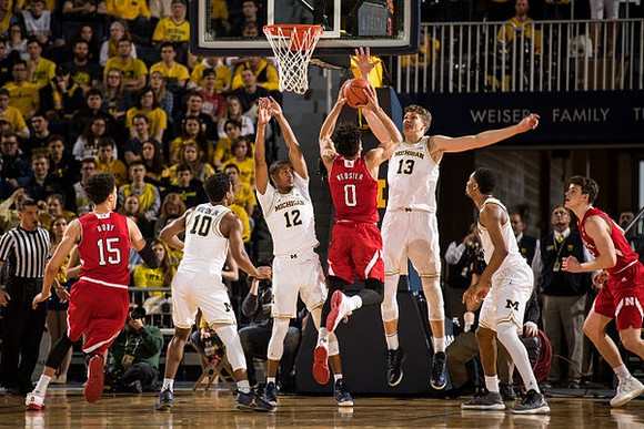 Derrick Walton Jr. (10), Muhammad-Ali Abdur-Rahkman (12), Moritz Wagner (13), and Zak Irvin (21)