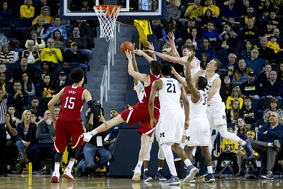 Zak Irvin (21), Moritz Wagner (13), Xavier Simpson (3), and Duncan Robinson (22)