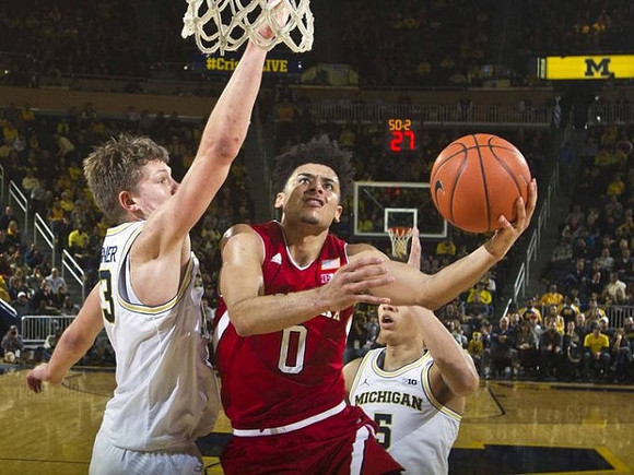 Moritz Wagner (13) and D.J. Wilson (5)