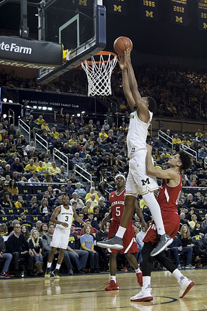 Zak Irvin (21) and Xavier Simpson (3)