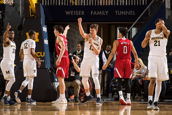 Derrick Walton Jr. (10), Muhammad-Ali Abdur-Rahkman (12), Moritz Wagner (13), and Zak Irvin (21)