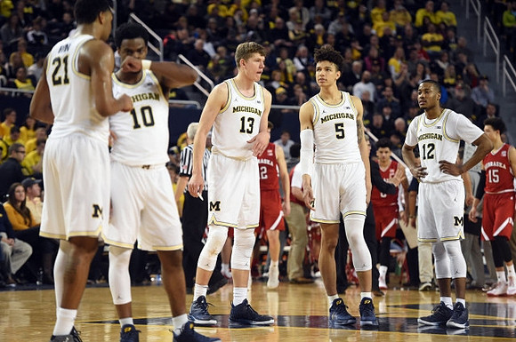 Zak Irvin (21), Derrick Walton Jr. (10), Moritz Wagner (13), D.J. Wilson (5), and Muhammad-Ali Abdur-Rahkman (12)