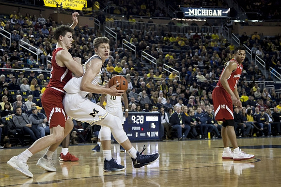 Moritz Wagner (13) and Derrick Walton Jr. (10)
