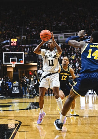 DeVante' Jones (12) and Moussa Diabate (14)