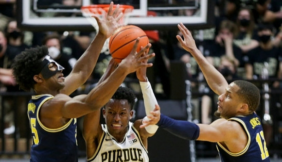 Jace Howard (25) and DeVante' Jones (12)