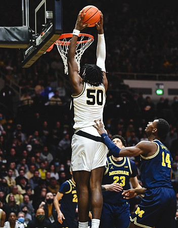 Caleb Houstan (22), Brandon Johns Jr. (23), and Moussa Diabate (14)