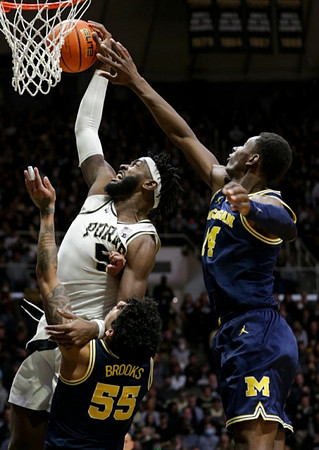 Eli Brooks (55) and Moussa Diabate (14)