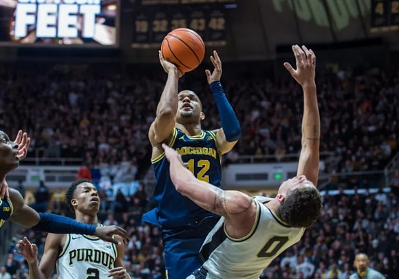 DeVante' Jones (12) and Moussa Diabate (14)