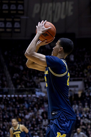 Caleb Houstan (22) and DeVante' Jones (12)