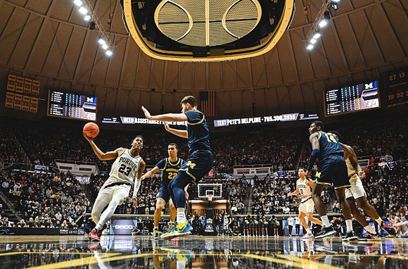Caleb Houstan (22), Hunter Dickinson (1), and Moussa Diabate (14)