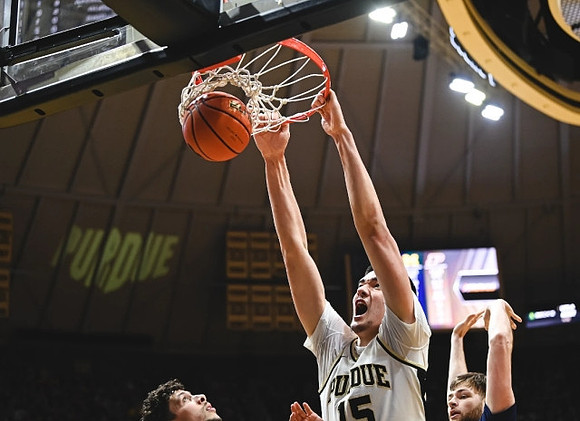 Brandon Johns Jr. (23) and Hunter Dickinson (1)
