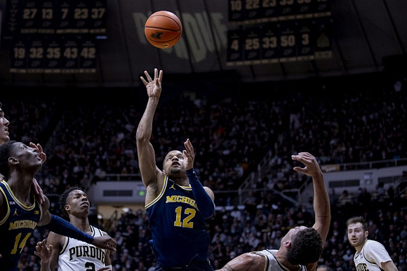 DeVante' Jones (12) and Moussa Diabate (14)