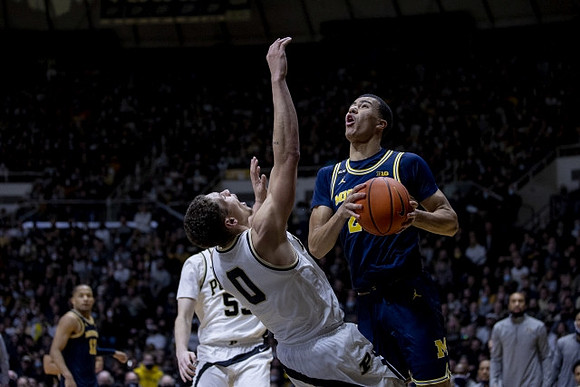 Caleb Houstan (22) and DeVante' Jones (12)
