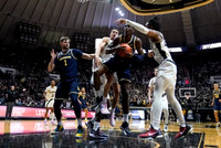 Hunter Dickinson (1), Moussa Diabate (14), DeVante' Jones (12), and Caleb Houstan (22)