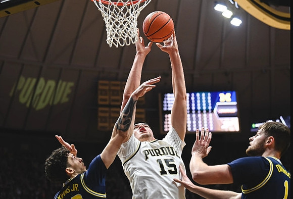 Brandon Johns Jr. (23) and Hunter Dickinson (1)