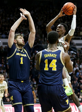 Hunter Dickinson (1) and Moussa Diabate (14)