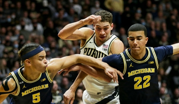 Terrance Williams II (5) and Caleb Houstan (22)