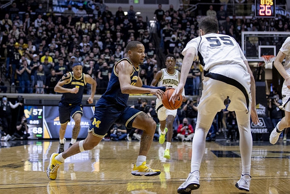 Terrance Williams II (5) and DeVante' Jones (12)
