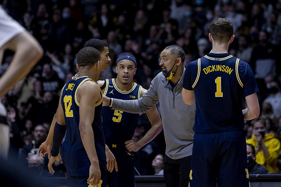 DeVante' Jones (12), Caleb Houstan (22), Terrance Williams II (5), Juwan Howard, and Hunter Dickinson (1)