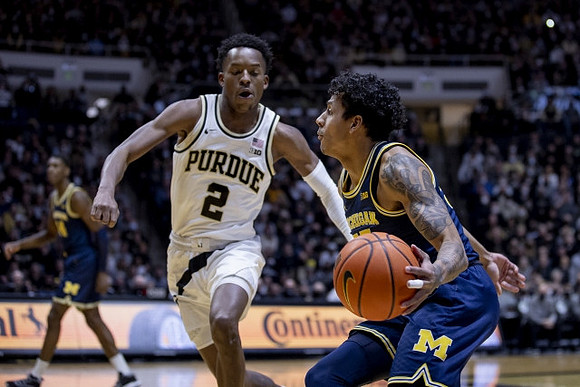 Eli Brooks (55) and Moussa Diabate (14)