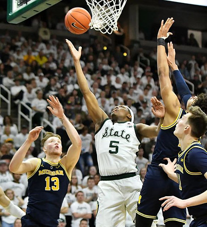 Ignas Brazdeikis (13), Jordan Poole (2), and Colin Castleton (11)