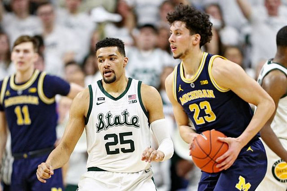 Colin Castleton (11) and Brandon Johns Jr. (23)